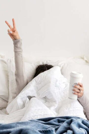 Woman waking up from the best night's sleep.