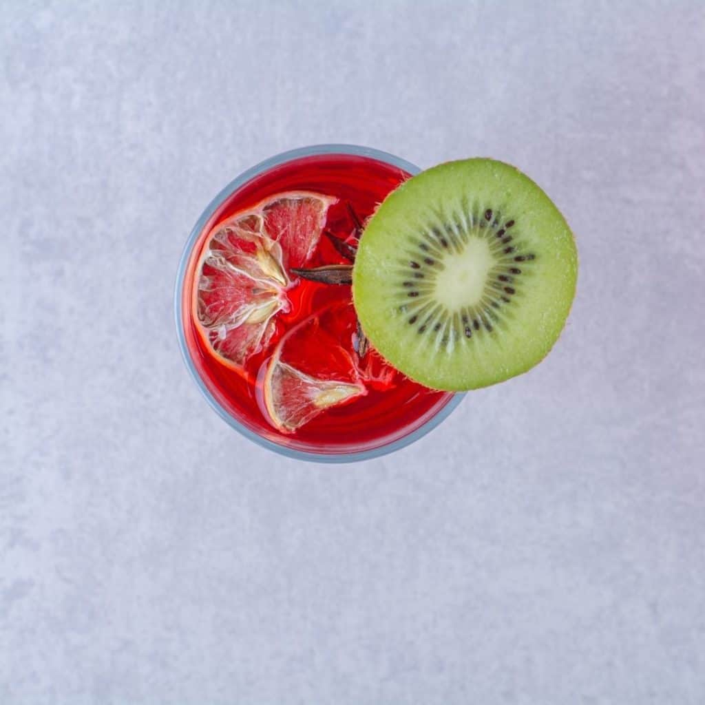 Cherry juice and kiwi in a glass great foods for sleep.