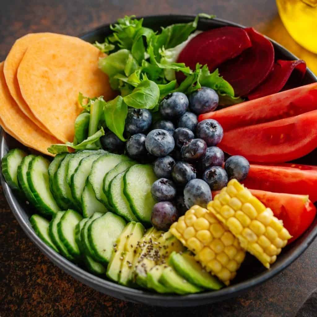 Buddha bowl with fresh fruits and vegetables is just one of the benefits in organic food.