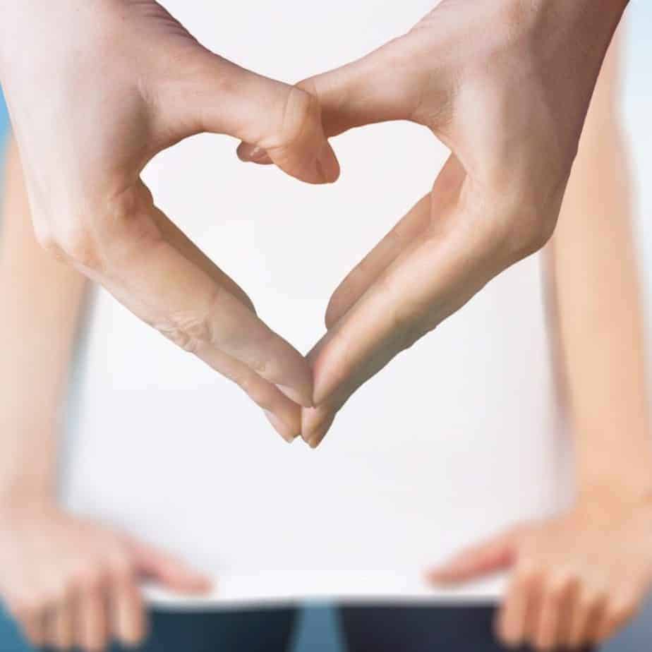 Healthy and happy hands creating a heart for beginner's guide to gut health. 