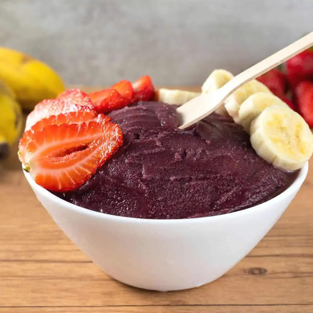 Goji strawberry sherbet smoothie made from a blender served in a white bowl.