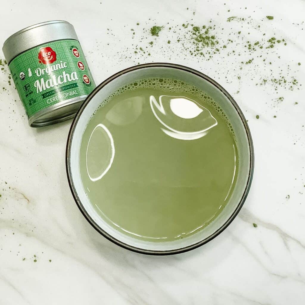 Stress relieving adaptogenic matcha latte in a mug.