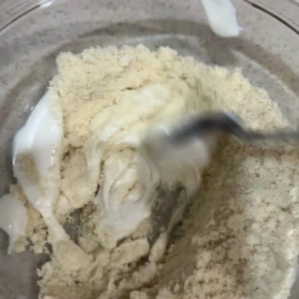 Mix together the yogurt and almond flour.