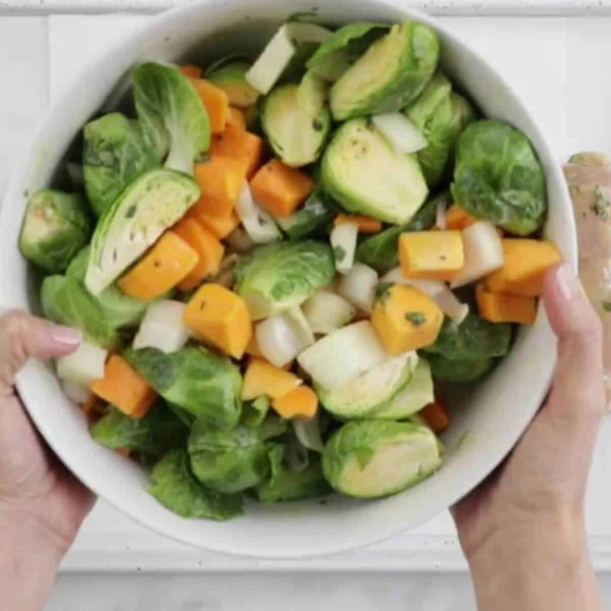 Toss squash onion and sprouts with remaining dressing in a small bowl