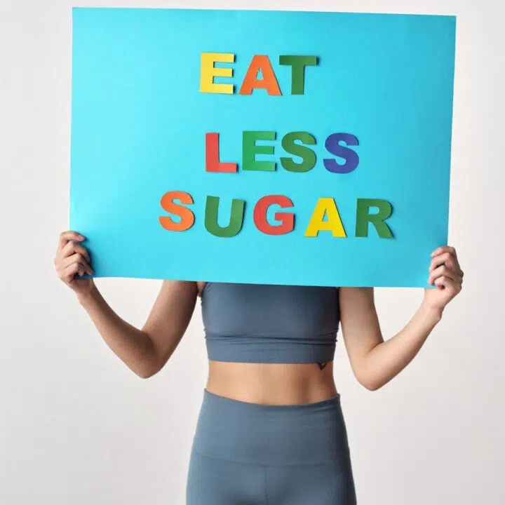 Woman eating less sugar to benefit her health.