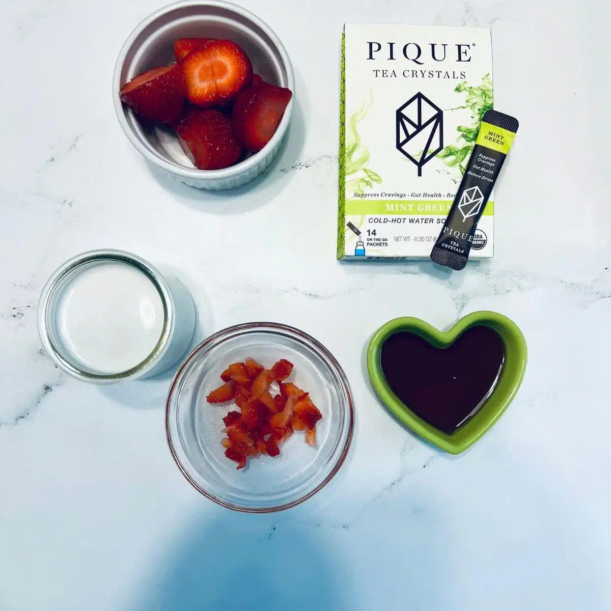 Ingredients for iced matcha drink, pique green tea powder.