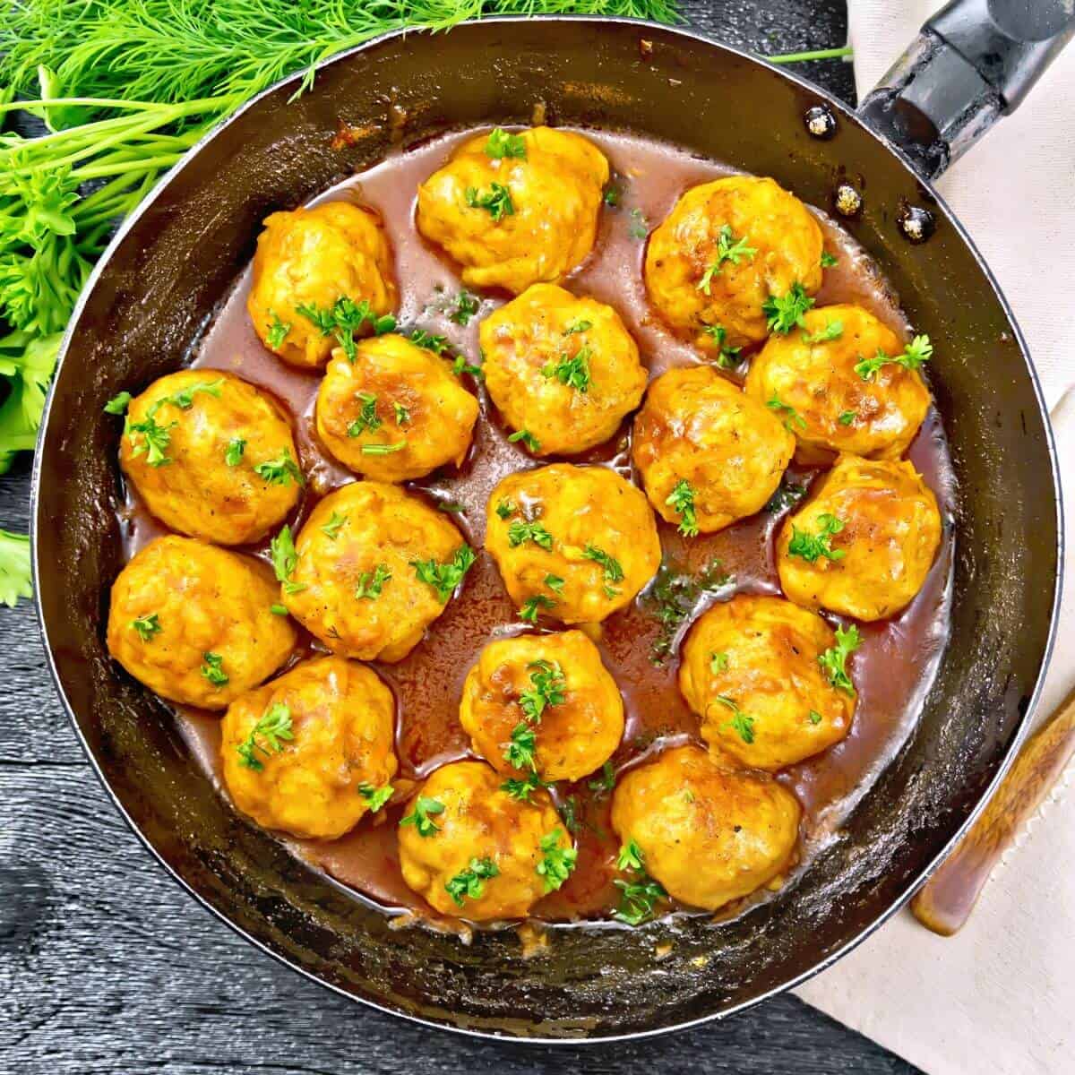 pan of homemade cooked turkey meatballs recipe with an Asian glaze