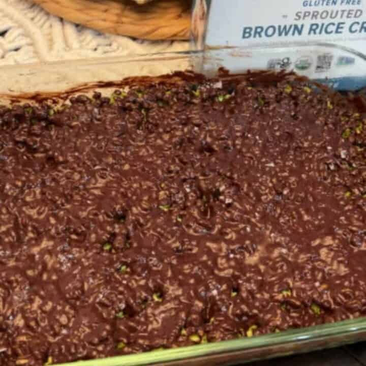 Melt chocolate chips in a double boiler or in the microwave. Pour the melted chocolate mixture over the top of the gluten-free rice krispies treat mixture in the baking pan. Allow to cool and enjoy.