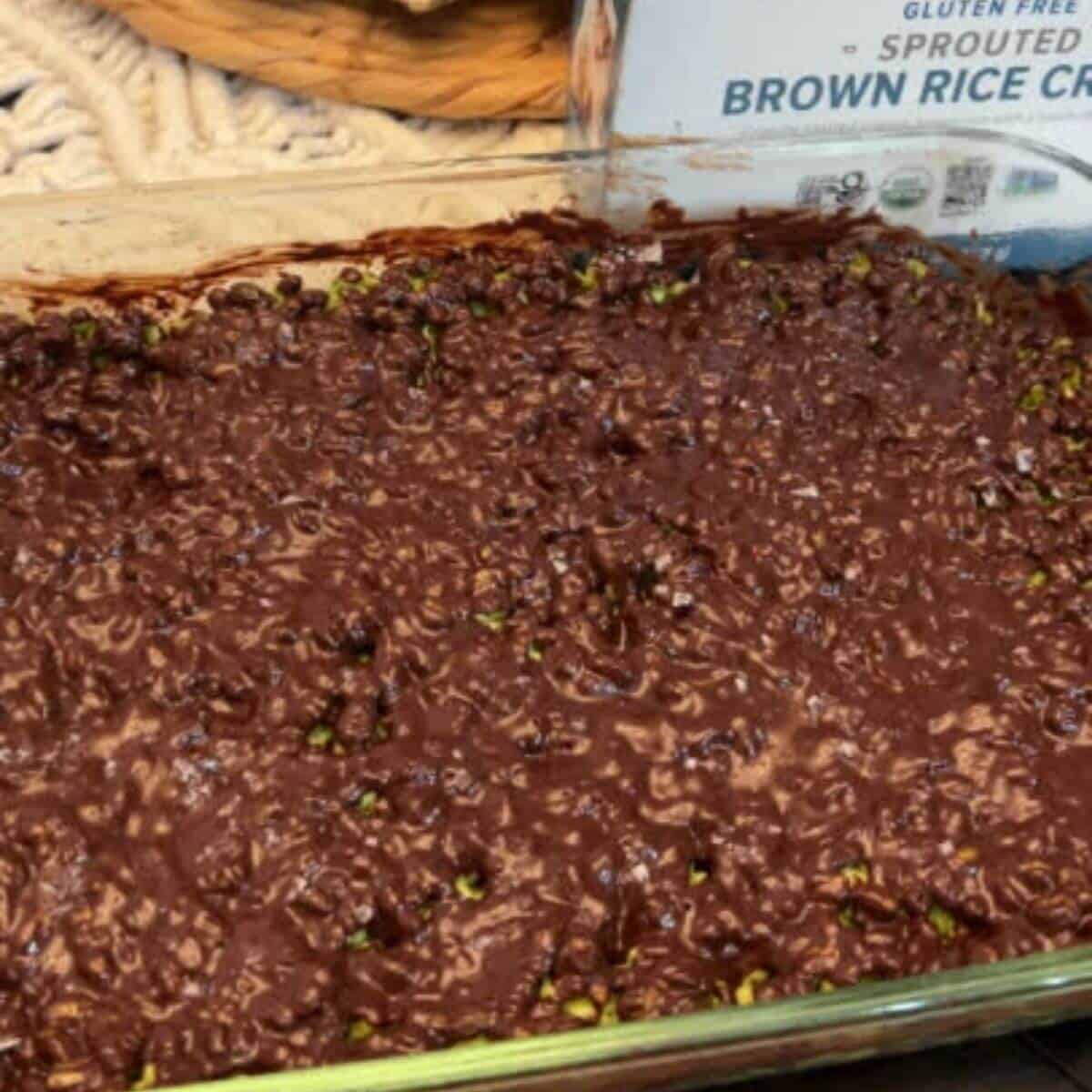 Melt chocolate chips in a double boiler or in the microwave. Pour the melted chocolate mixture over the top of the gluten-free rice krispies treat mixture in the baking pan. Allow to cool and enjoy.