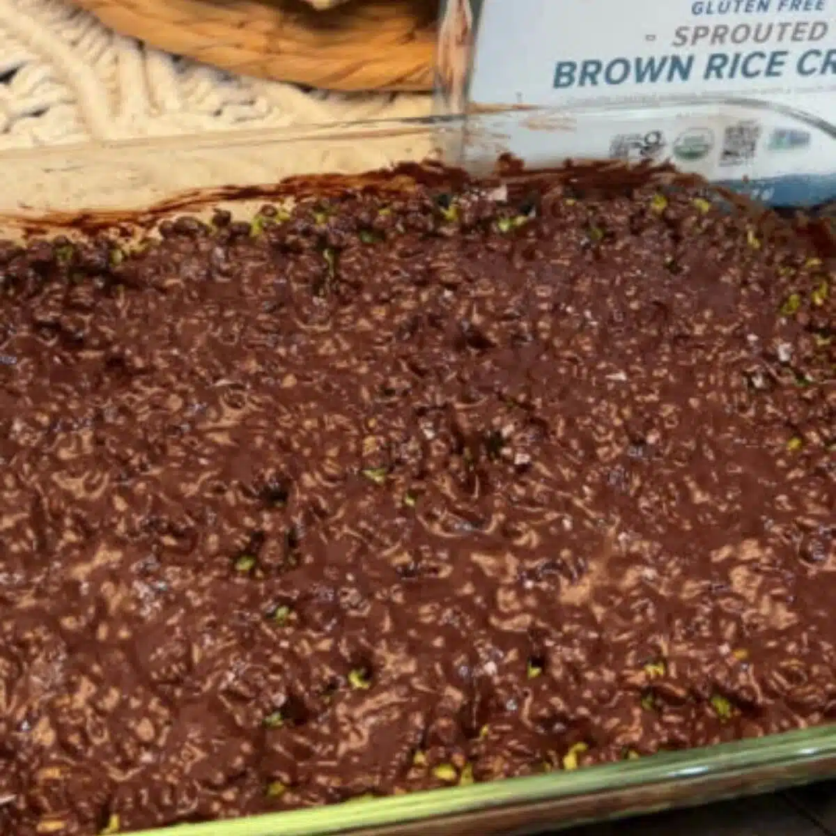 Melt chocolate chips in a double boiler or in the microwave. Pour the melted chocolate mixture over the top of the gluten-free rice krispies treat mixture in the baking pan. Allow to cool and enjoy.