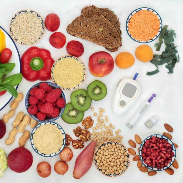 Fruits, vegetables and grains around a blood glucose meter